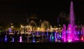 Enchanting grandiose musical performance - water and light show of a musical fountain on the embankment, in the center of the city