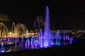 Enchanting grandiose musical performance - water and light show of a musical fountain on the embankment, in the center of the city