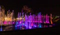 Enchanting grandiose musical performance - water and light show of a musical fountain on the embankment, in the center of the city