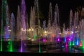 Enchanting grandiose musical performance - water and light show of a musical fountain on the embankment, in the center of the city