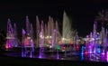 Enchanting grandiose musical performance - water and light show of a musical fountain on the embankment, in the center of the city