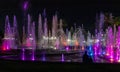 Enchanting grandiose musical performance - water and light show of a musical fountain on the embankment, in the center of the city