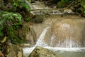 Enchanting waterfall with gentle flowing water on a big rock