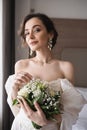 enchanting young woman in wedding dress