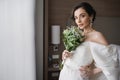 enchanting young woman in white wedding