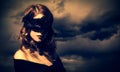 Enchantress at storm sky background. Royalty Free Stock Photo