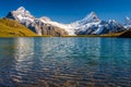 Encountering Bachalpsee when hiking First to Grindelwald Bernese Alps, Switzerland. Royalty Free Stock Photo