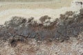 ENCRUSTED VERGE OF MINERAL WATER IN A SALT LAKE WITH FOAM AND BUBBLES