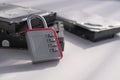 Encrypted hard disk. Padlock with cipher on an opened hard disk. Data loss. computer motherboard. the concept of data
