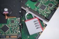Encrypted hard disk. Padlock with cipher on an opened hard disk. Data loss. computer motherboard. the concept of data