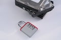 Encrypted hard disk. Padlock with cipher on an opened hard disk. Data loss. computer motherboard. the concept of data