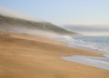 Foggy beach end the end of the afternoon Royalty Free Stock Photo