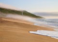 Foggy beach end the end of the afternoon Royalty Free Stock Photo