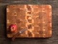 End cutting board made of oak and apple wood. Apple and knife