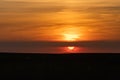 The end of the day just before the sunsets on the horizon with an amazing orange glow in riemst near Maastricht Royalty Free Stock Photo