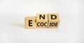 End ecocide symbol. Turned wooden cubes with words end ecocide. Beautiful white background, copy space. Business, ecological and