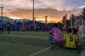 End of football tournament, Cambodian players relaxing on the sward