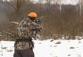 End of hunting season. Hunter shooting in the field.