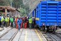 At the End of the Inca Trail to Machu Picchu local Guides are taking the Baggage for the Tourists from the Train in Ollantaytambo. Royalty Free Stock Photo