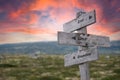 end limit boundary text engraved in wooden signpost outdoors in nature during sunset Royalty Free Stock Photo