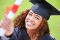 The end of one era, the beginning of a next. Portrait of a young woman holding her diploma on graduation day. Royalty Free Stock Photo