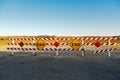 End of road signs and reflectors on red and white striped wood barrier Royalty Free Stock Photo