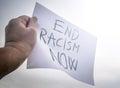 End Racism Now- message written on a banner Royalty Free Stock Photo