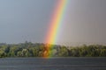 The end of a rainbow during a storm over the Susquehanna River