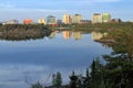 Yellowknife Skyline reflected in the Still Waters of Frame Lake in Evening Light, Northwest Territories, Canada Royalty Free Stock Photo