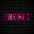 The end red neon sign. Vintage movie ending neon frame on black brick background. Vector Royalty Free Stock Photo