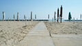 Closed parasols on the beach Royalty Free Stock Photo