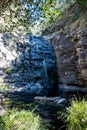 End of summer and a trickle of water over Sheoak falls, Great Ocean Road, Victoria, Australia Royalty Free Stock Photo