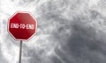 End-to-End - red sign with clouds in background