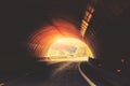 End of the tunnel. Driving a car on a mountain road Royalty Free Stock Photo