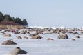 People enjoy springtime with melting ice stacks in Gulf of Riga