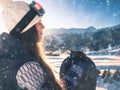 End of winter season. Portrait of snowboarder girl on the background of high mountain