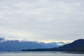 Endicott Arm, Alaska, USA: Snow-capped mountains under a cloudy sky in the Endicott Arm Royalty Free Stock Photo