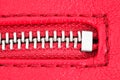 Ending of metal zipper on intense red leather jacket or purse detail close up macro Royalty Free Stock Photo