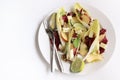 Endive leaves stuffed with cheese, walnuts, apple, radishes, honey and lime. Royalty Free Stock Photo