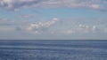 endless blue calm sea or lake with blue sky with white clouds Royalty Free Stock Photo