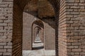 Endless brick passage with repeating archways in Fort Jefferson on Dry Tortugas National Park. Royalty Free Stock Photo