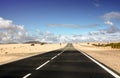 Endless coastal road and sand Royalty Free Stock Photo