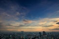 Endless Dark Blue Sky with Strange Orange Clouds over City