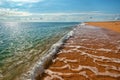 Endless deserted yellow sand beach