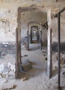 Endless doors in vintage old ruined building with damaged plaster walls Royalty Free Stock Photo