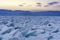 Endless hummock field on the frozen Lake Baikal. Piles of snow-covered debris of blue ice on a frosty day. Cold natural Royalty Free Stock Photo