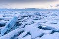 Endless hummock field on the frozen Lake Baikal. Piles of snow-covered debris of blue ice on a frosty day. Cold natural Royalty Free Stock Photo