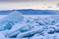 Endless hummock field on the frozen Lake Baikal. Piles of snow-covered debris of blue ice on a frosty day. Cold natural Royalty Free Stock Photo