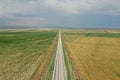 Endless long and straight landroad in Turkey on a sunny day