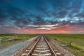 Endless railroad in open rural countryside